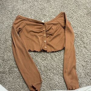 Brown/orangish long sleeve crop top.